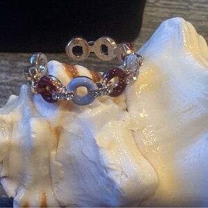 New, Silver tone ceramic coated donut ring. Lilac blue and cranberry